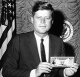 JFK Holding a Savings Bond